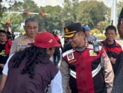Senyum Manis  AKBP Douglas Mahendrajaya Pimpin Langsung Pengamanan Hari Buruh
